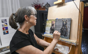 DeAnn Meely works in her Bank Street studio on some of the pieces inspired by a recent trip to Alaska. [JERONIMO NISA]