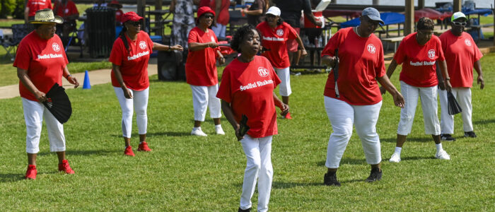 The Soulful Shakers dance at Rhodes Ferry Park during a Memorial Day barbecue for senior citizens who participate in Turner-Surles Community Center’s activities.