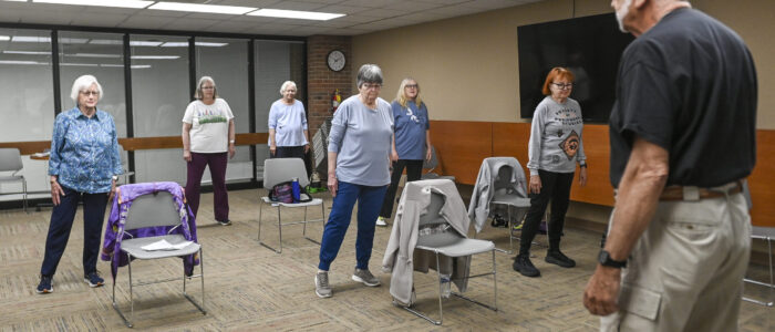 Senior citizens participate in a tai chi class at Decatur Public Library.