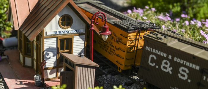 A train arrives at the Burningtree station in Barb and Mark Brown’s garden railroad.