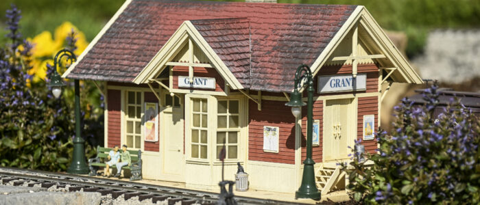 Barb and Mark Brown’s garden railroad contains features that have to do with their life, like the station of Grant, Colorado, where Barb lived for some years.
