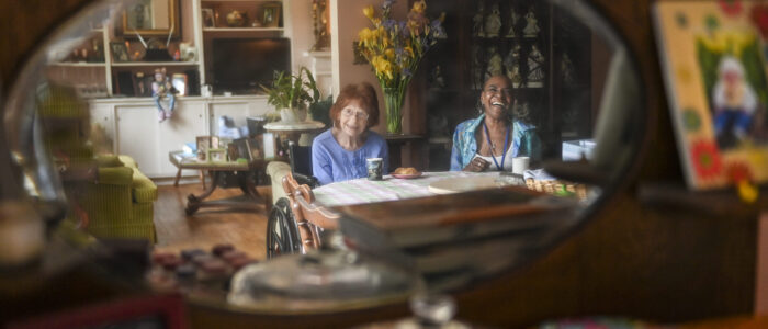 Senior Companion program volunteer Linda Floyd, right, laughs as Janice Allison says something funny. Floyd spends time with Allison most week days.