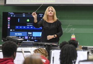 Regina Raney leads the Austin Junior High School band’s morning practice. [JERONIMO NISA]