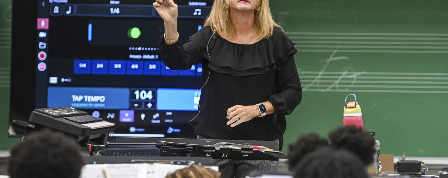 Regina Raney leads the Austin Junior High School band’s morning practice. [JERONIMO NISA]