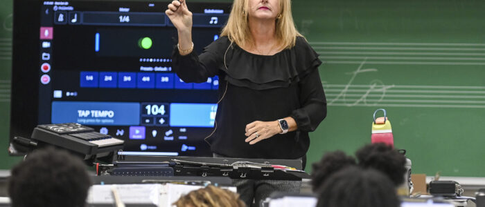 Regina Raney leads the Austin Junior High School band’s morning practice. [JERONIMO NISA]