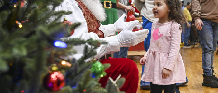 Emery Sapp talks to Santa Claus (Paul Martin) during Decatur Fire & Rescue’s Special Needs Character Pancake Party at the Church at Stone River last year. [JERONIMO NISA]