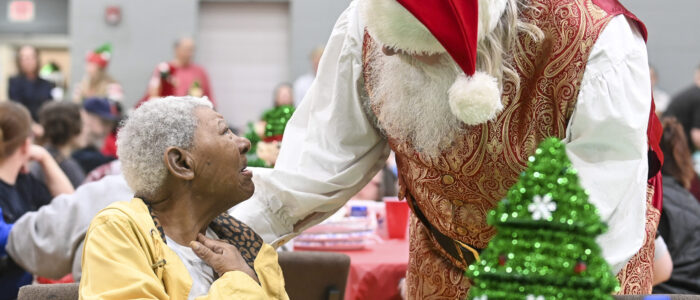 Willie Jackson chats with Santa Claus (Paul Martin) during Decatur Fire & Rescue’s Special Needs Character Pancake Party at the Church at Stone River last year. [JERONIMO NISA]